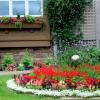 Coordinating beds, with windowbox planting.
